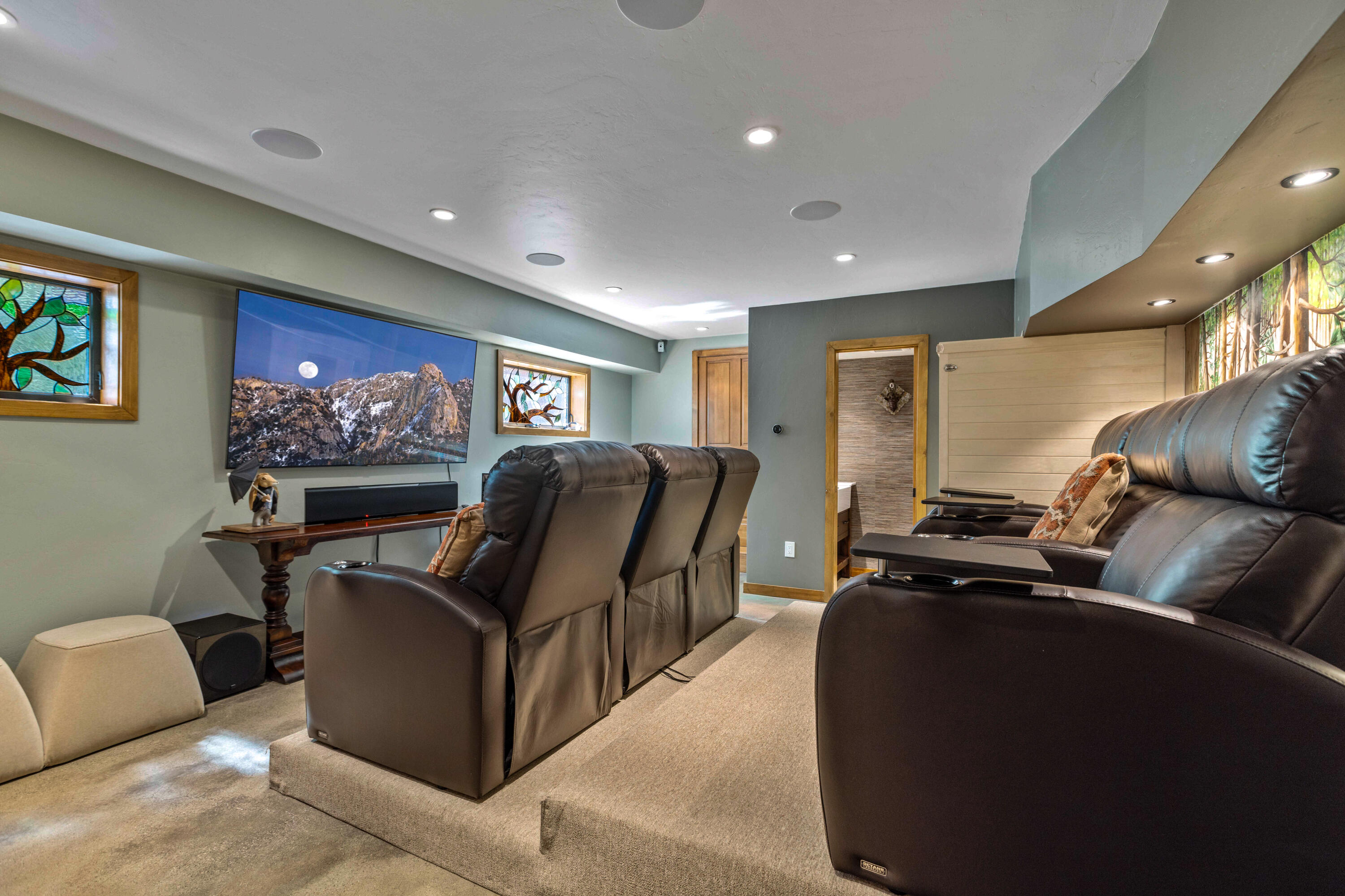 24581 Fern Valley Road Idyllwild, CA 92549 - Photo 33 of 45 a living room with furniture a flat screen tv and a couch