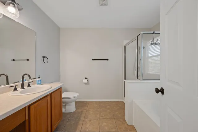 a bathroom with a bathtub with a shower