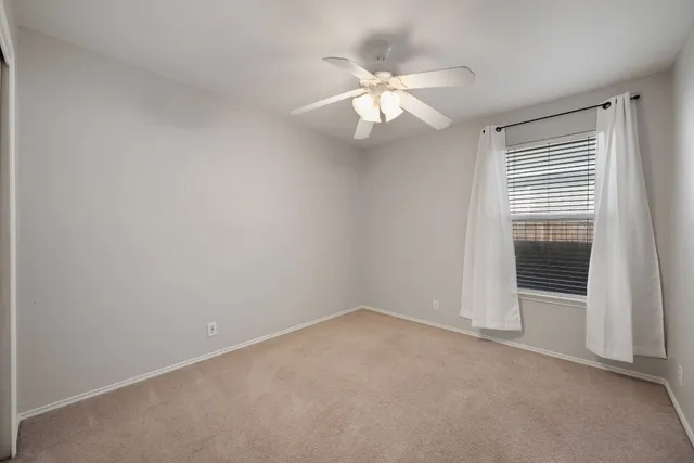 a bathroom with a toilet a sink and a mirror
