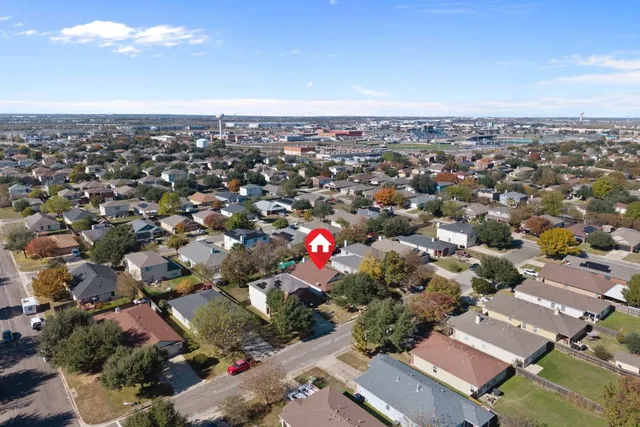 an aerial view of house with yard