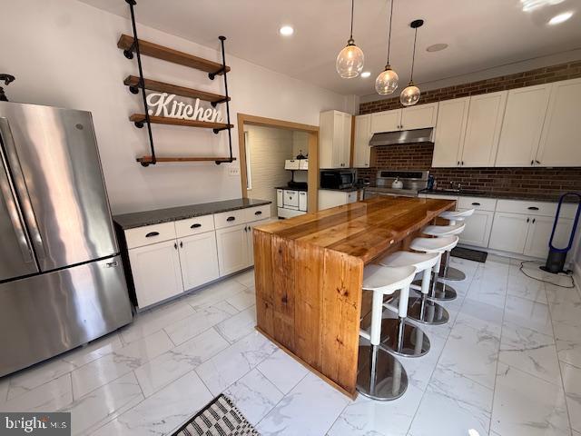 8104 Overlook Court Frederick, MD 21702 - Photo 12 of 12 a kitchen with stainless steel appliances granite countertop a stove top oven a sink a dining table and chairs