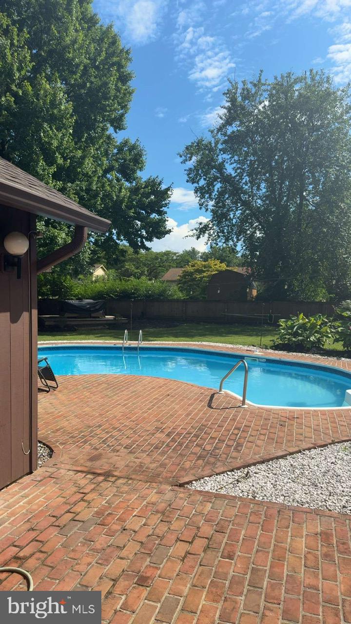 8104 Overlook Court Frederick, MD 21702 - Photo 10 of 12 a view of a swimming pool and an outdoor space