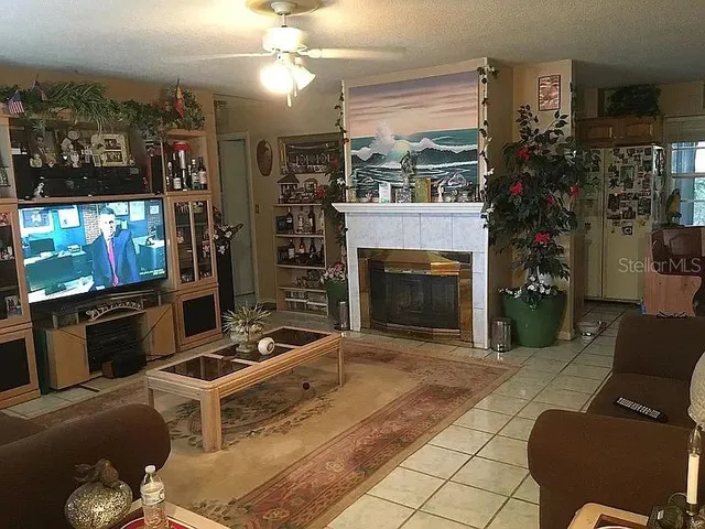 a view of a dining room with furniture and a chandelier
