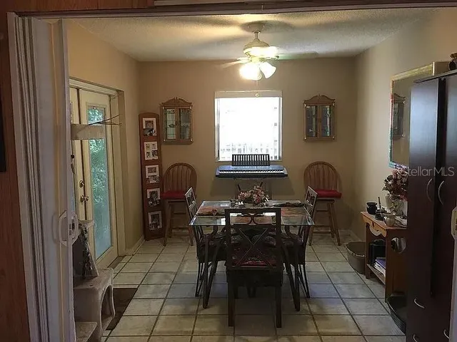 a kitchen with a sink a stove and a refrigerator
