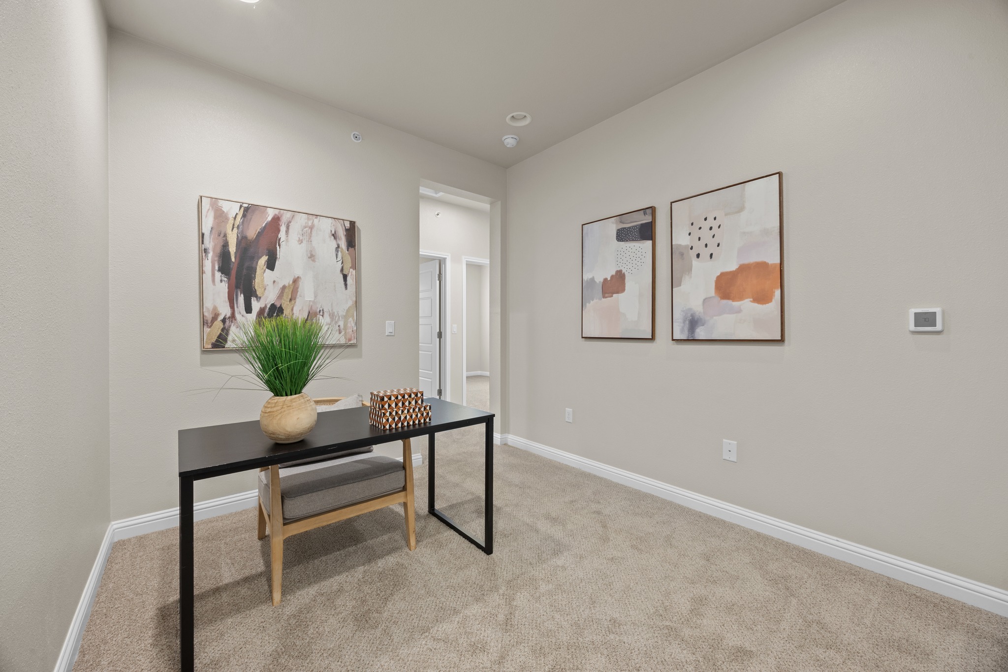 6814 East Riverside Drive, Unit 104 Austin, TX 78741 - Photo 19 of 37 a room with furniture and a potted plant