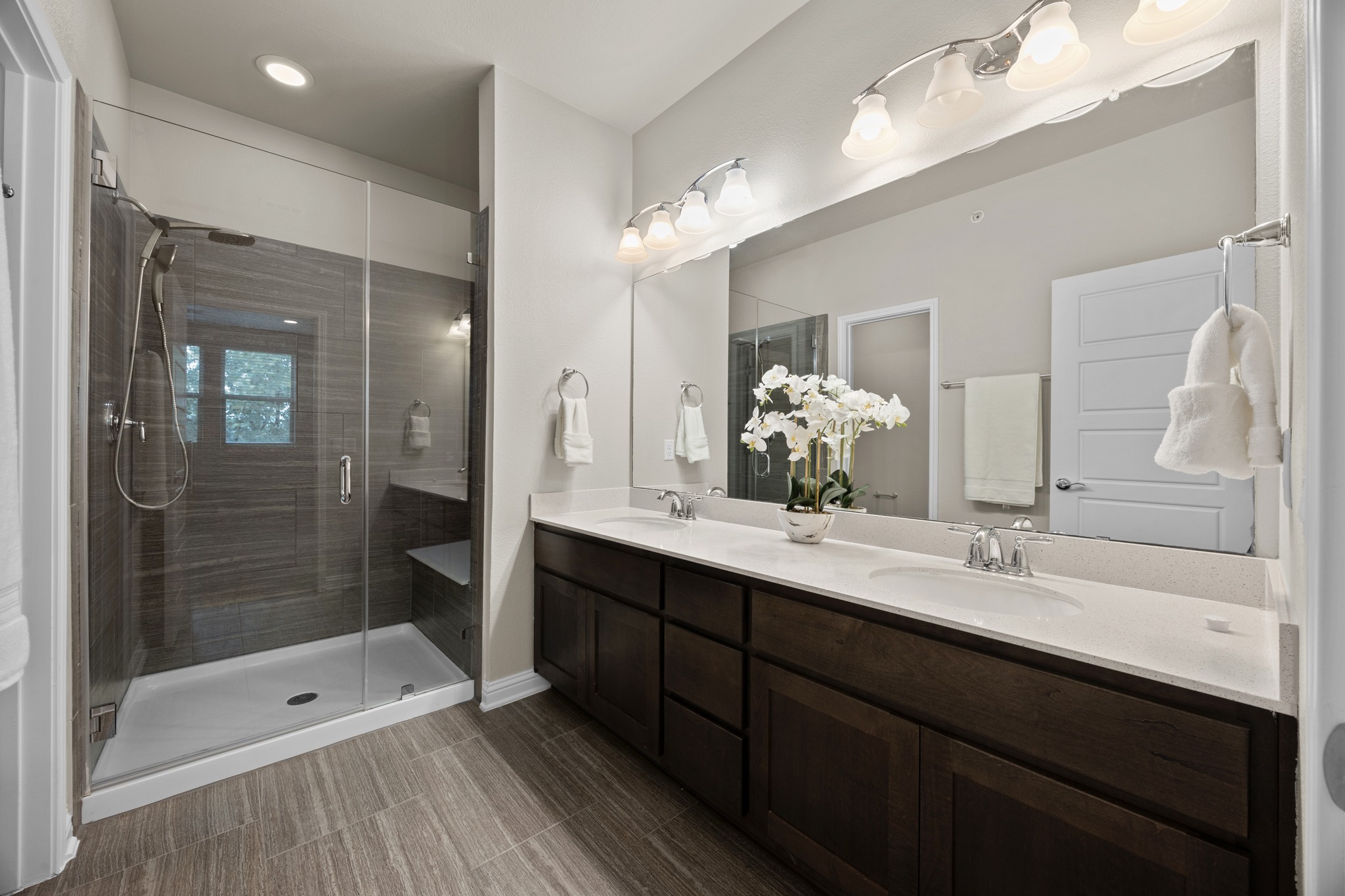 6814 East Riverside Drive, Unit 104 Austin, TX 78741 - Photo 24 of 37 a bathroom with a shower sink and mirror