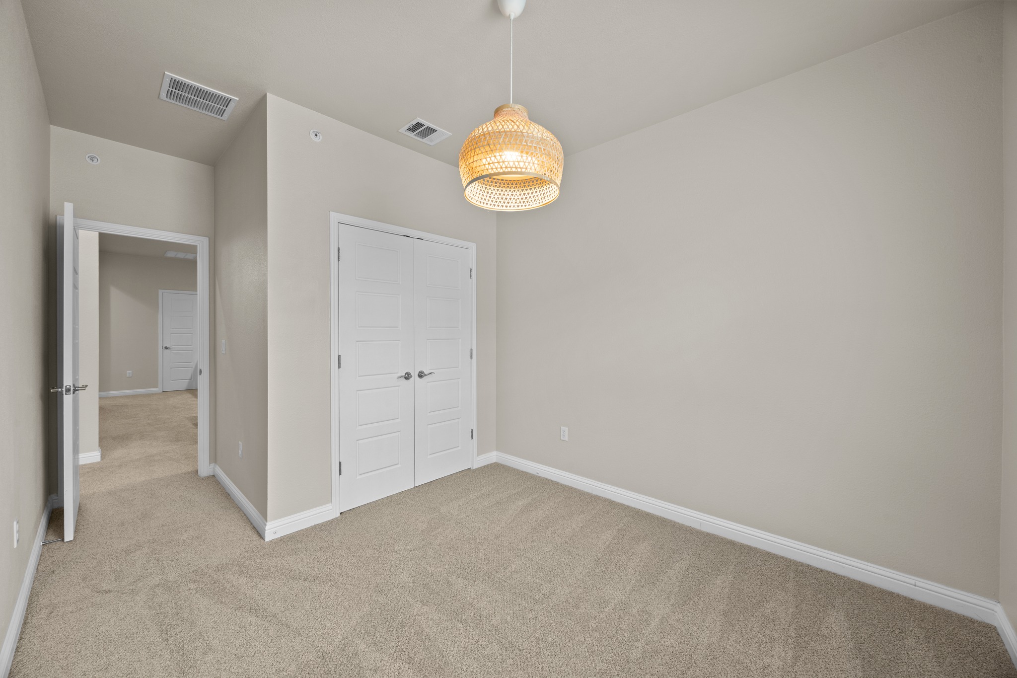 6814 East Riverside Drive, Unit 104 Austin, TX 78741 - Photo 29 of 37 a view of an empty room with window and wooden floor