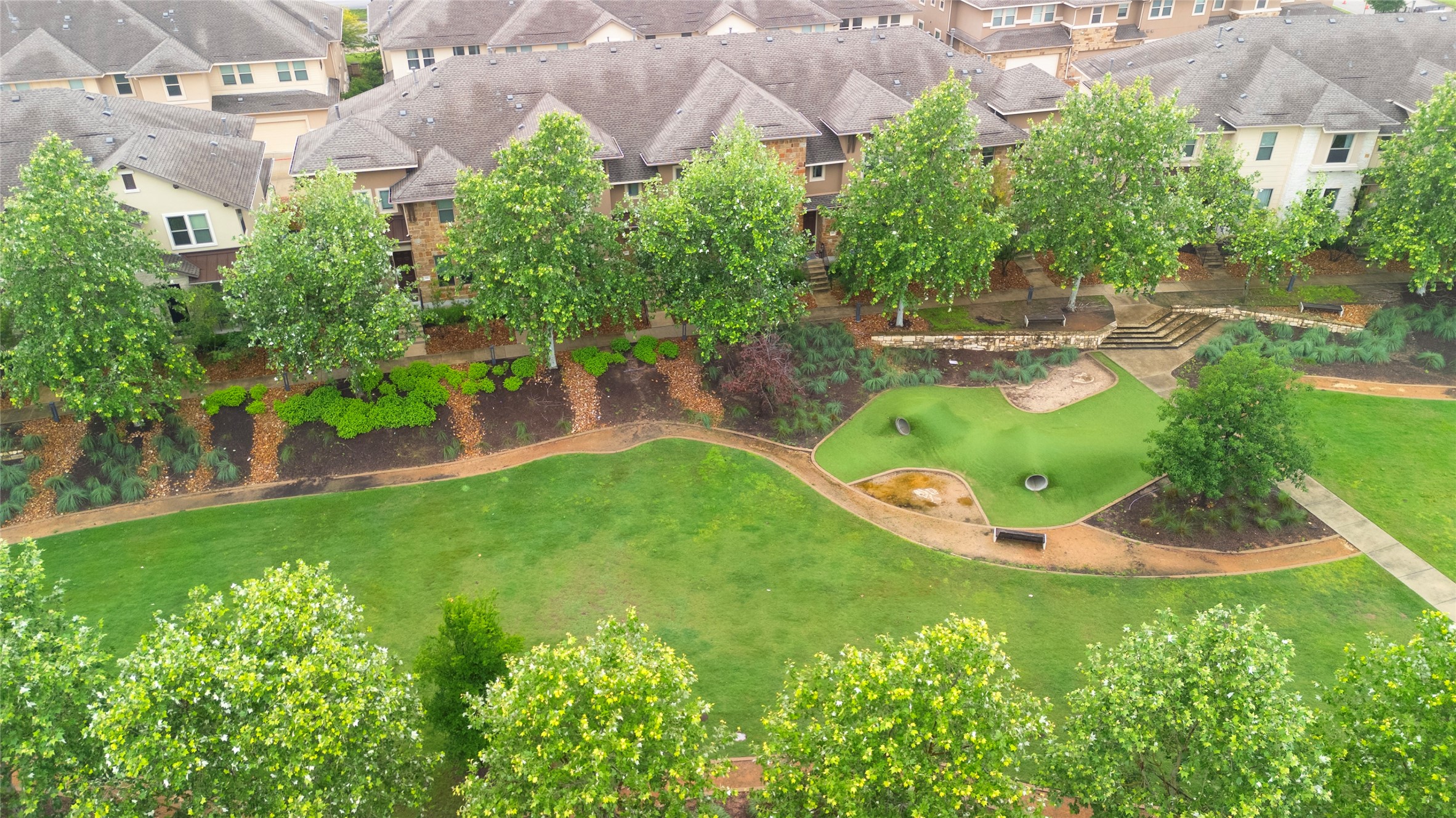 6814 East Riverside Drive, Unit 104 Austin, TX 78741 - Photo 33 of 37 an aerial view of residential house with outdoor space and trees all around