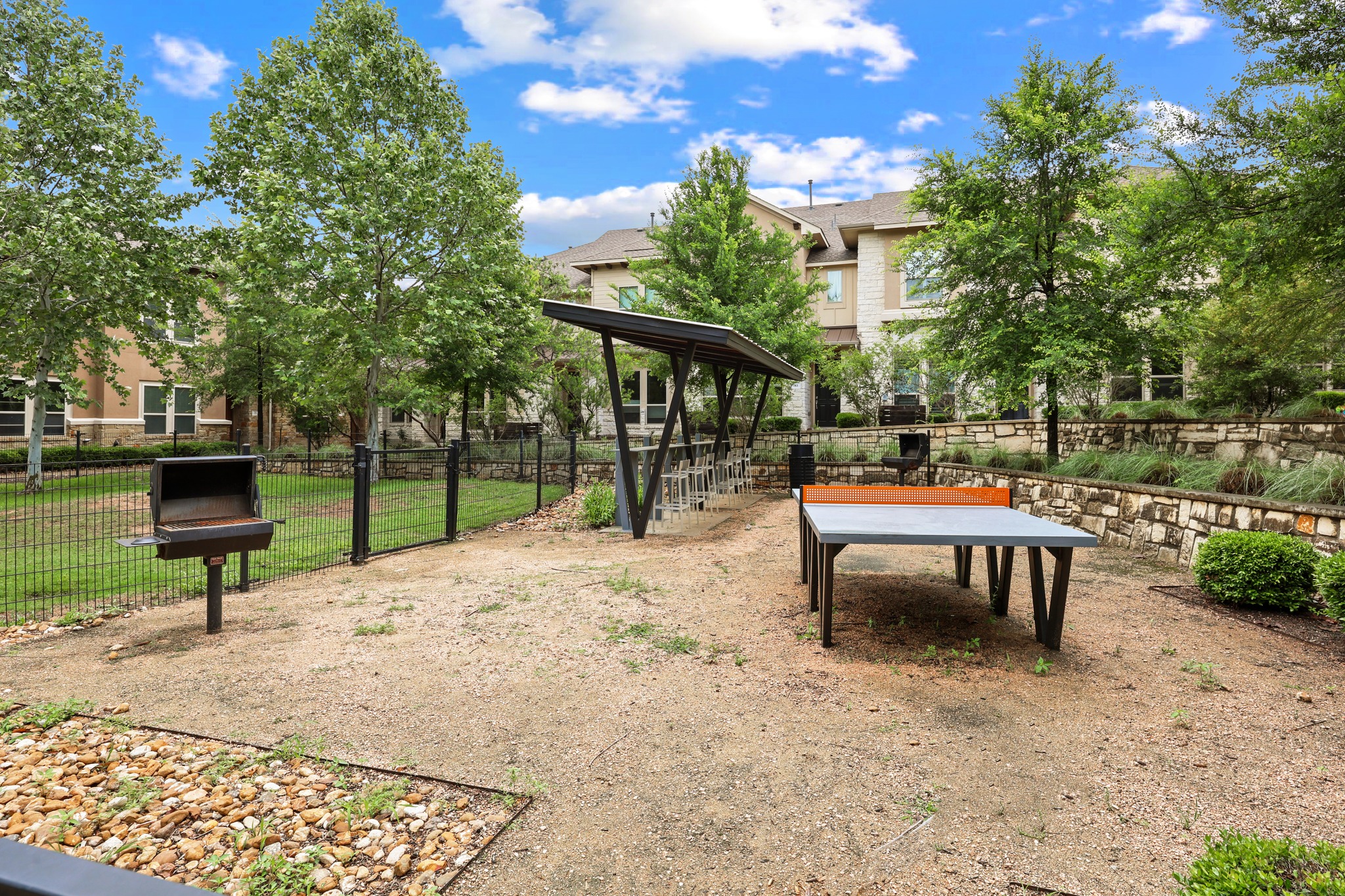 6814 East Riverside Drive, Unit 104 Austin, TX 78741 - Photo 37 of 37 a view of a bench in a backyard