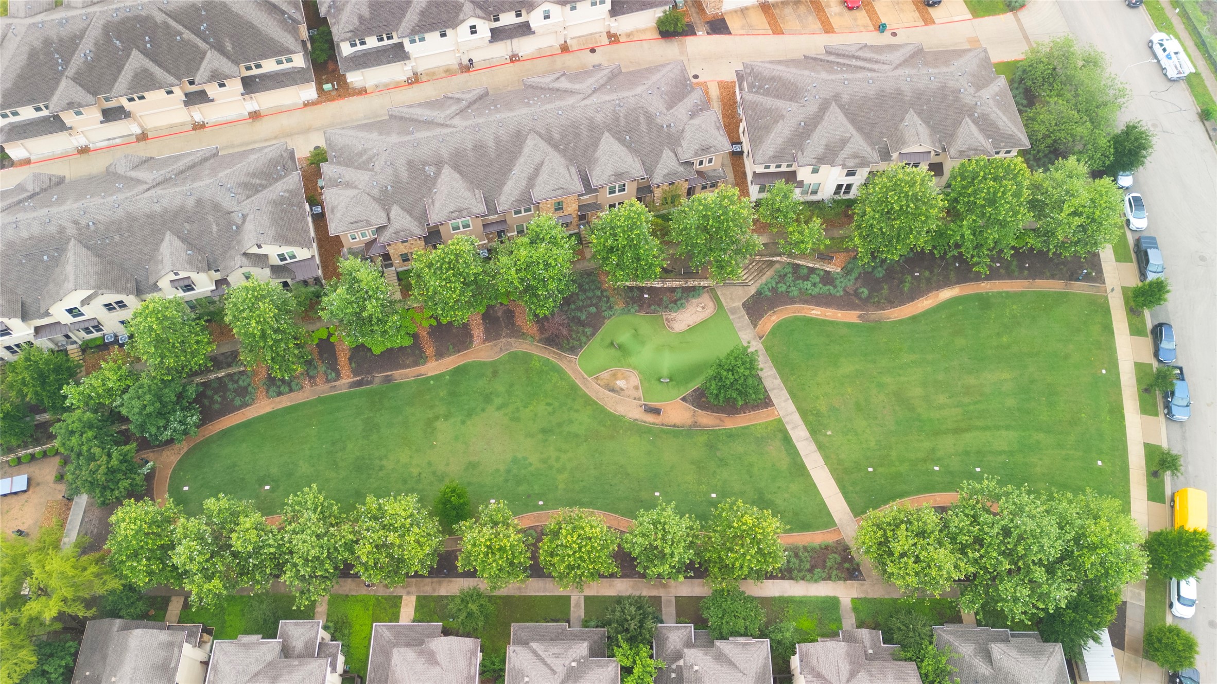 6814 East Riverside Drive, Unit 104 Austin, TX 78741 - Photo 5 of 37 a view of a garden with a fountain