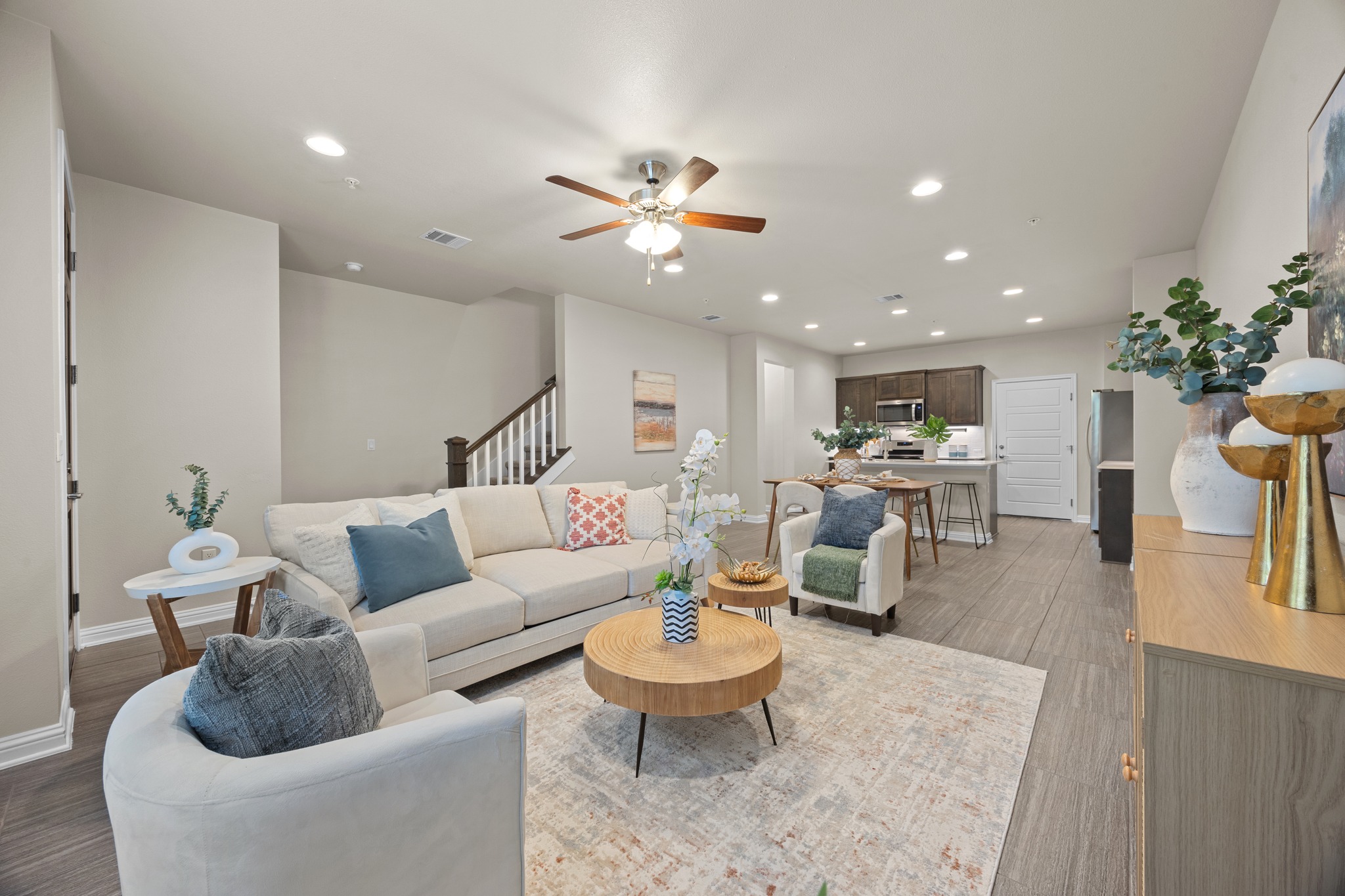 6814 East Riverside Drive, Unit 104 Austin, TX 78741 - Photo 10 of 37 a living room with furniture and a chandelier