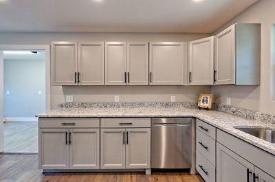750 Sunnyside Road Hiawassee, GA 30546 - Photo 17 of 46 a kitchen with stainless steel appliances granite countertop a sink and cabinets