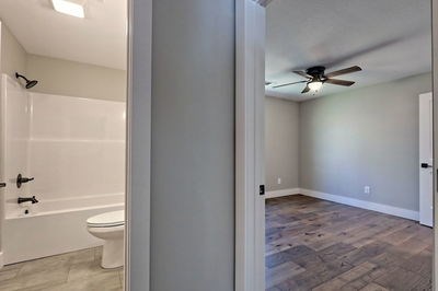 750 Sunnyside Road Hiawassee, GA 30546 - Photo 29 of 46 a bathroom with a toilet a sink and a bathtub