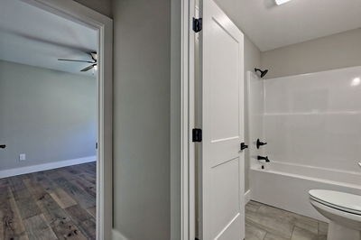 750 Sunnyside Road Hiawassee, GA 30546 - Photo 32 of 46 a bathroom with a granite countertop bathtub shower and toilet