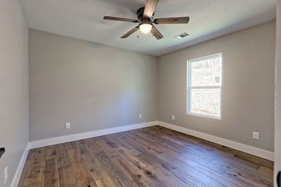 750 Sunnyside Road Hiawassee, GA 30546 - Photo 33 of 46 a view of empty room with wooden floor and fan