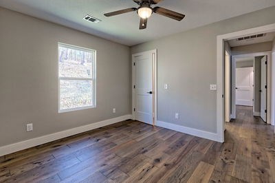 750 Sunnyside Road Hiawassee, GA 30546 - Photo 34 of 46 a view of an empty room with window and wooden floor