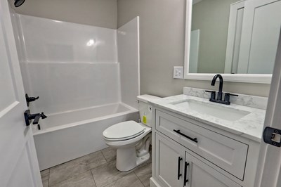 750 Sunnyside Road Hiawassee, GA 30546 - Photo 39 of 46 a bathroom with a sink a toilet and a mirror