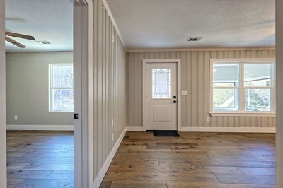 750 Sunnyside Road Hiawassee, GA 30546 - Photo 41 of 46 an empty room with wooden floor and windows