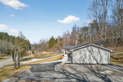 750 Sunnyside Road Hiawassee, GA 30546 - Photo 42 of 46 a view of a house with a yard