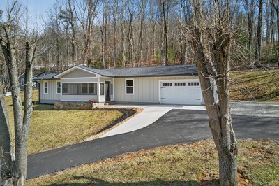 750 Sunnyside Road Hiawassee, GA 30546 - Photo 43 of 46 a front view of a house with garden