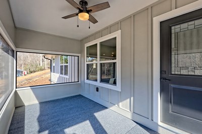 750 Sunnyside Road Hiawassee, GA 30546 - Photo 5 of 46 a view of an empty room with a window and wooden floor