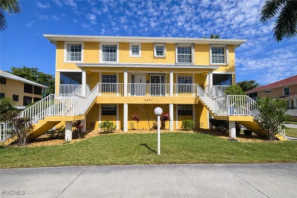 a front view of a house with a yard