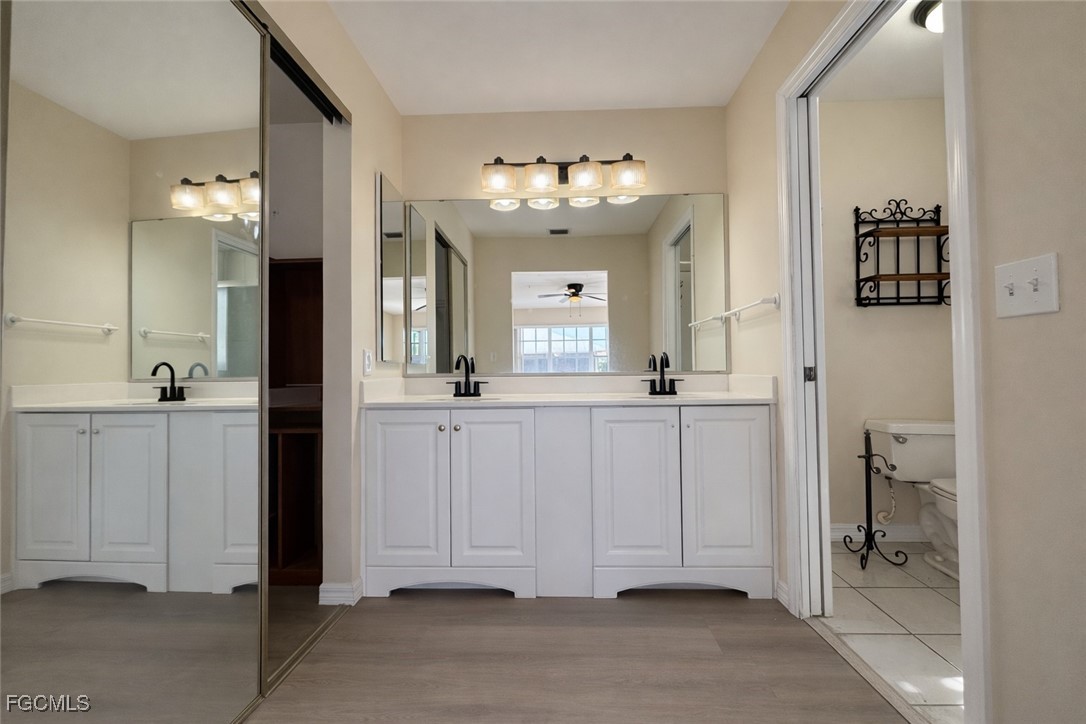 5390 Park Road, Unit 3 Fort Myers, FL 33908 - Photo 13 of 26 a view of a bathroom with closet and mirror