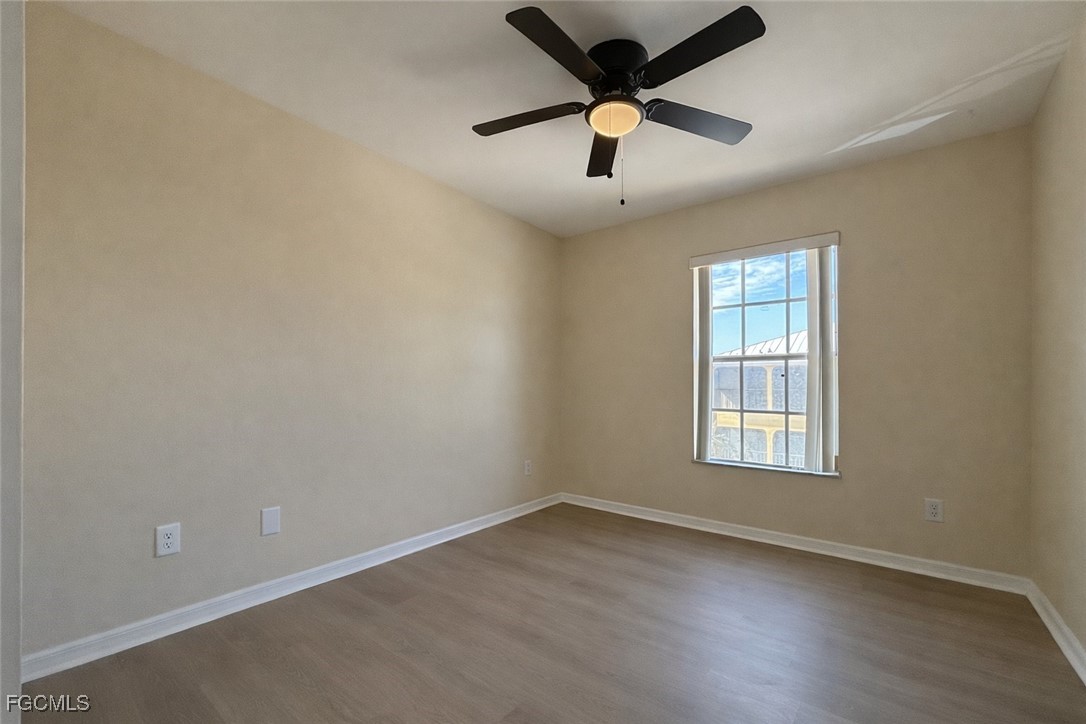 5390 Park Road, Unit 3 Fort Myers, FL 33908 - Photo 17 of 26 an empty room with a window and a fan