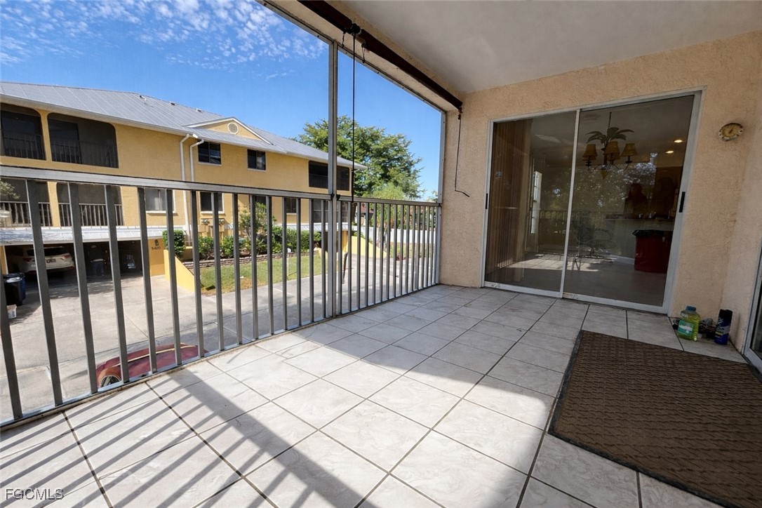 5390 Park Road, Unit 3 Fort Myers, FL 33908 - Photo 25 of 26 a view of a balcony with wooden floor