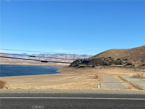 a view of an ocean and a mountain