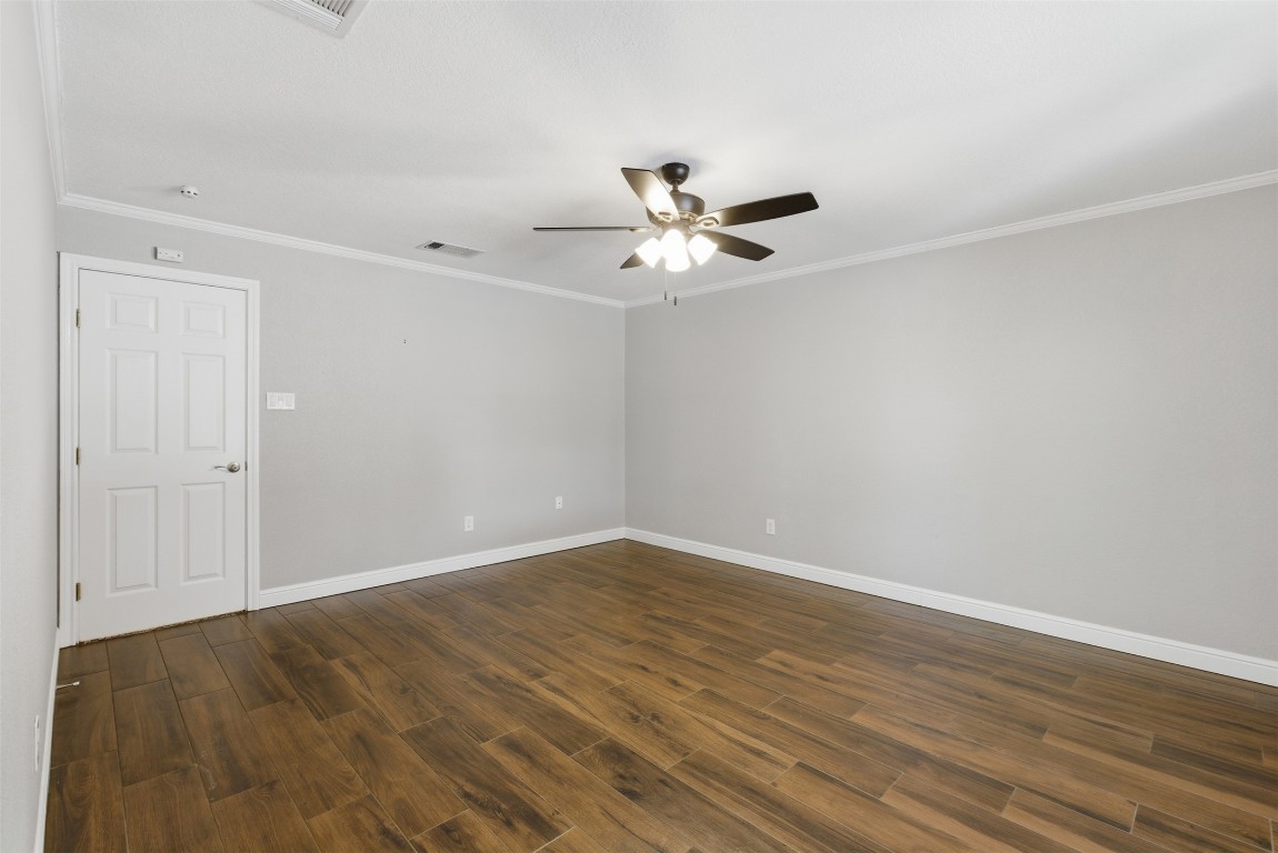 1600 East Messick Loop Round Rock, TX 78681 - Photo 24 of 38 Another view of the primary bedroom showing more options and the door leading to the hallway.