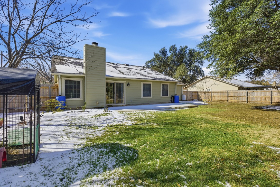 1600 East Messick Loop Round Rock, TX 78681 - Photo 34 of 38 The back yard is level and holds many possible uses. There are water reclamation barrels and full gutters!