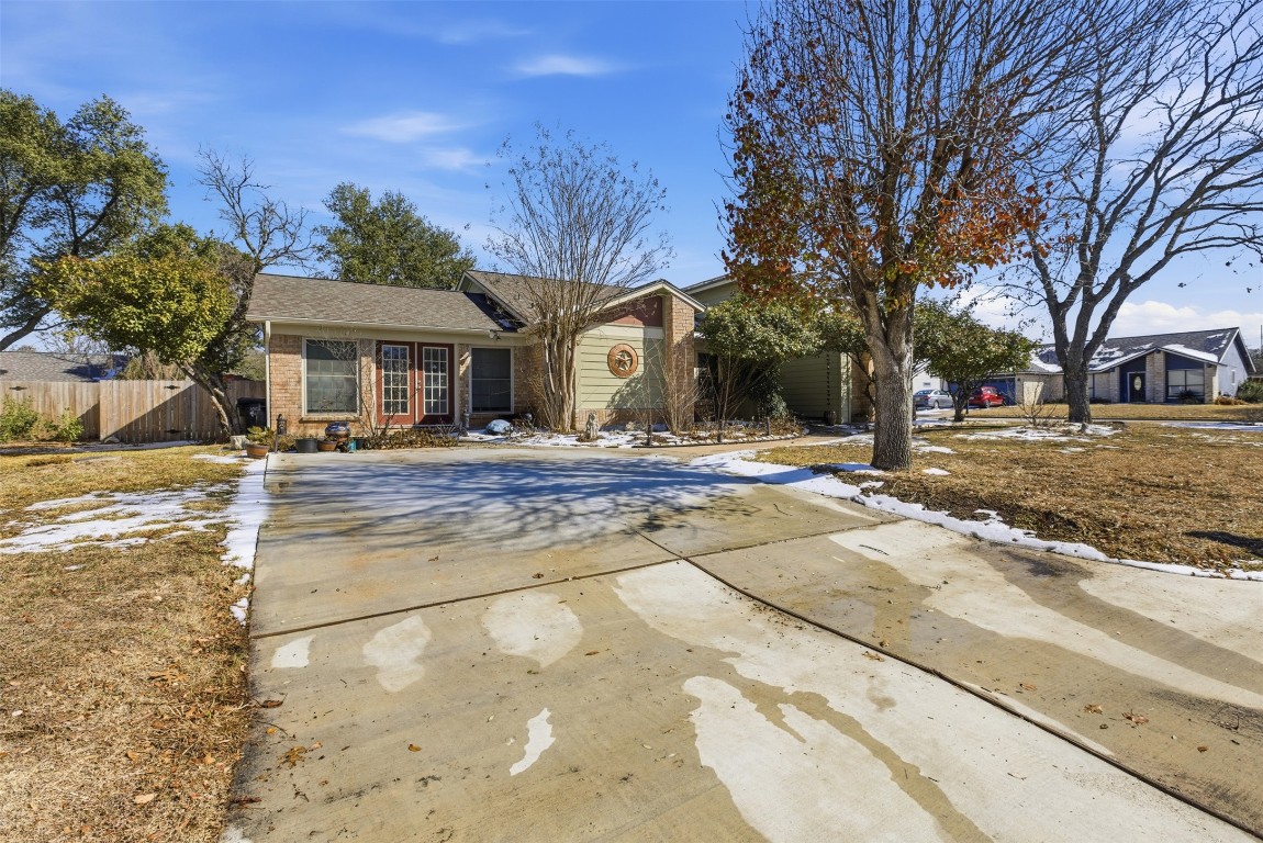 1600 East Messick Loop Round Rock, TX 78681 - Photo 37 of 38 The bonus room has a private entry door, perfect for a home business. There is room to extend the footprint to the driveway and make a 2 car garage if desired.