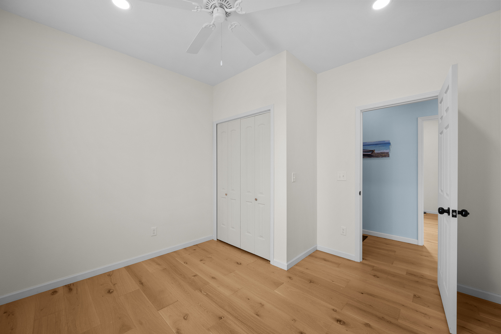 317 South Walnut Street Wilton, IA 52778 - Photo 14 of 45 wooden floor in an empty room