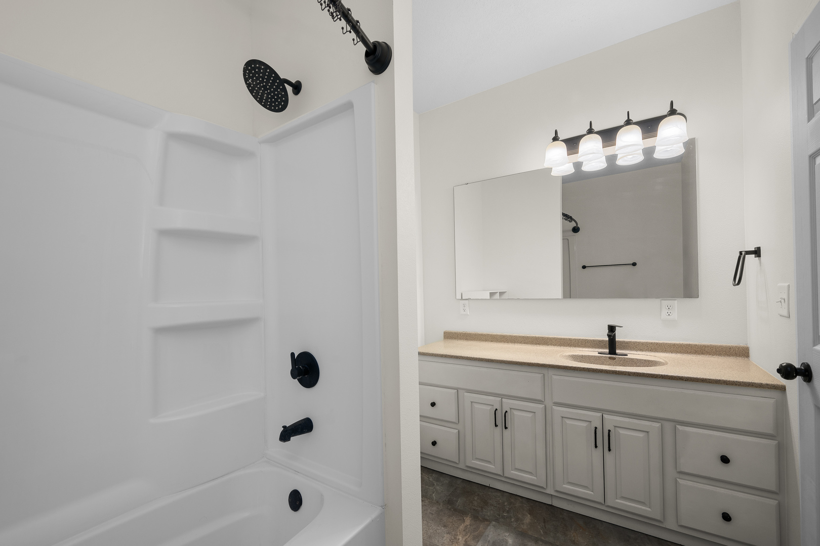 317 South Walnut Street Wilton, IA 52778 - Photo 20 of 45 a bathroom with a sink and a mirror