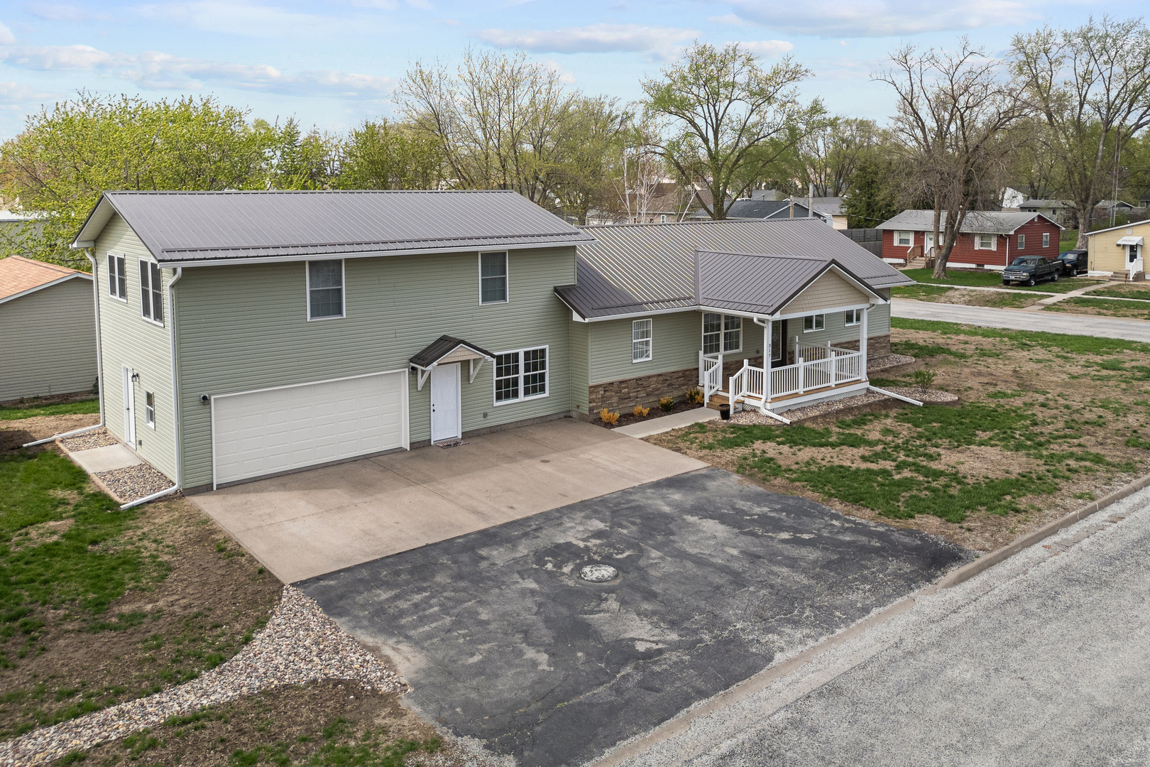 317 South Walnut Street Wilton, IA 52778 - Photo 2 of 45 a front view of a house with garden