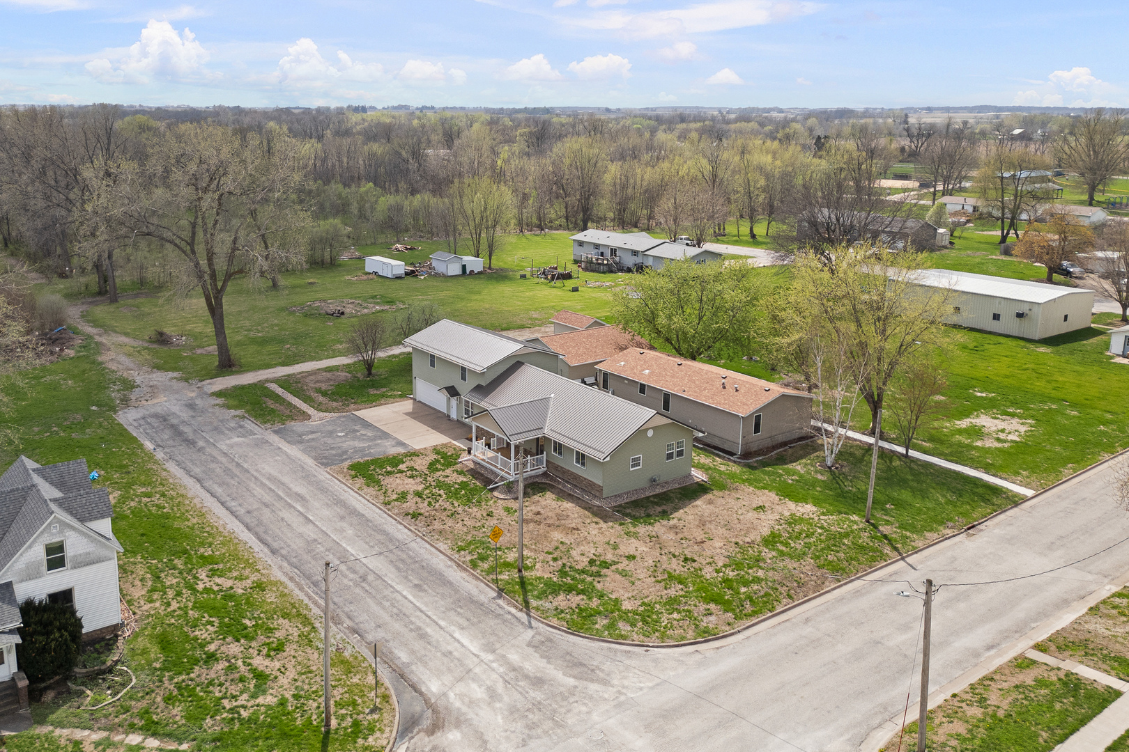 317 South Walnut Street Wilton, IA 52778 - Photo 39 of 45 an aerial view of a house with a garden and lake view