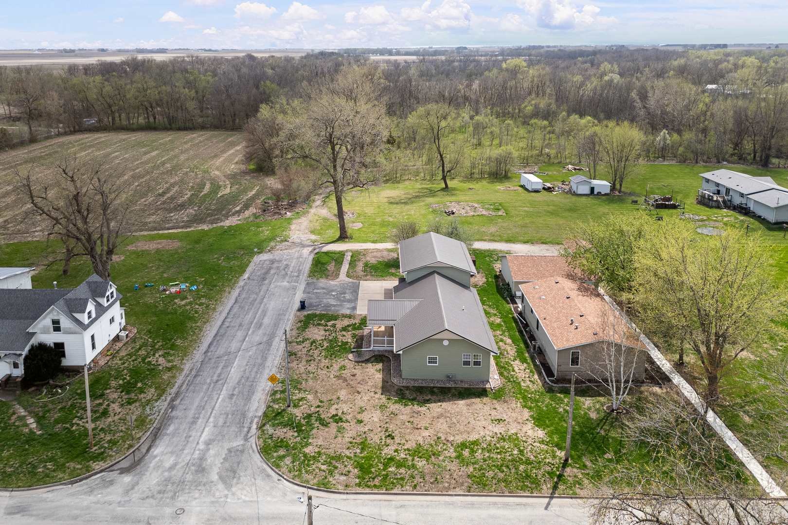 317 South Walnut Street Wilton, IA 52778 - Photo 40 of 45 an aerial view of a house with a yard