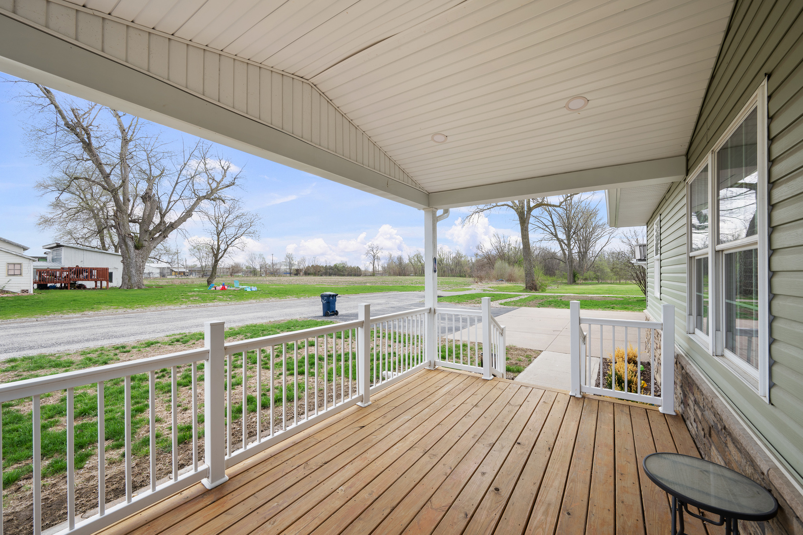317 South Walnut Street Wilton, IA 52778 - Photo 4 of 45 a view of a deck with wooden floor and outdoor seating