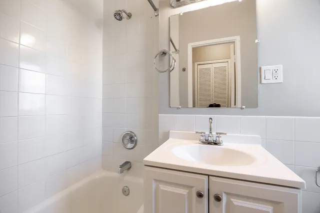 a kitchen with refrigerator and window