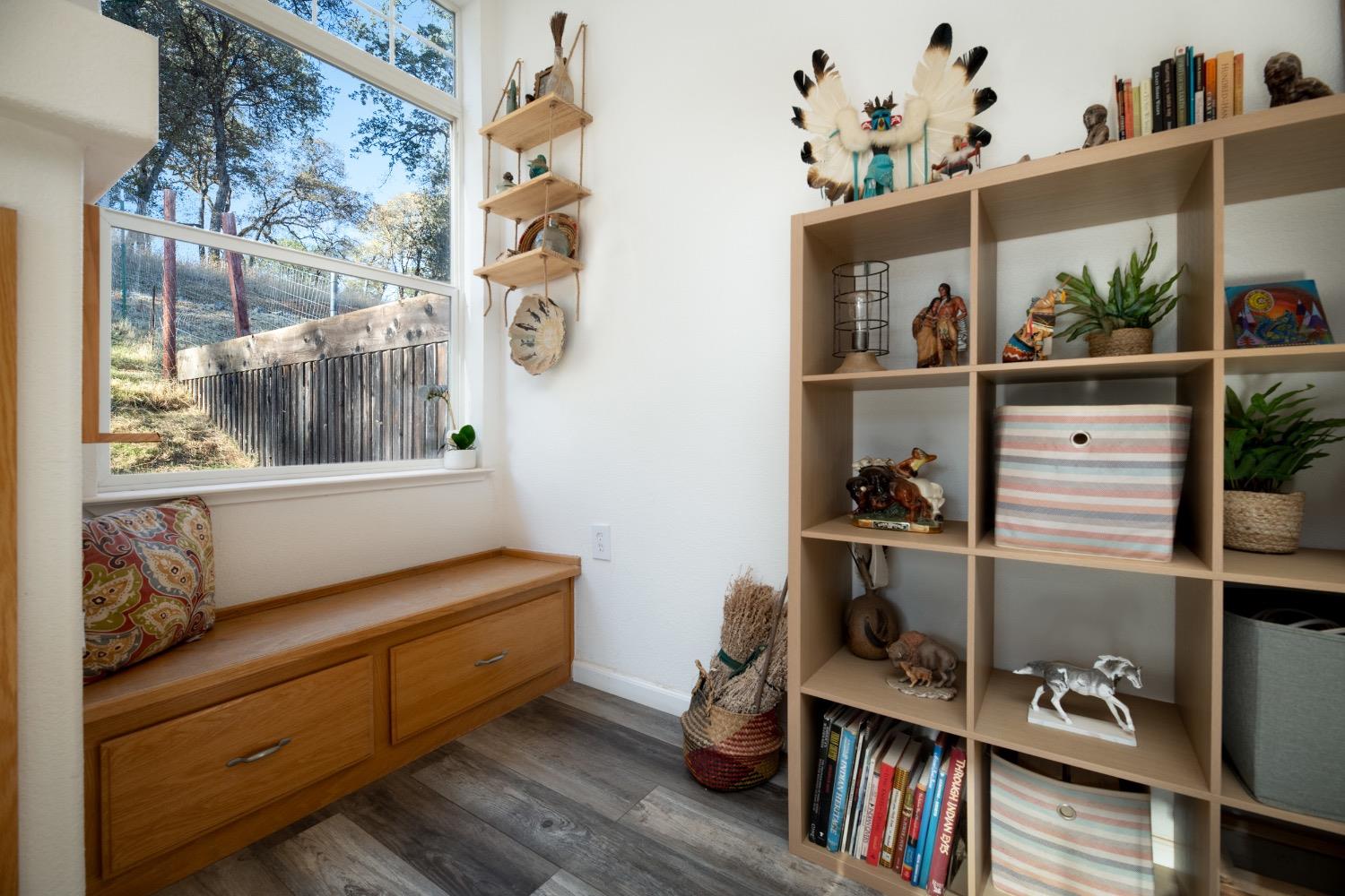 24090 Restive Way Grass Valley, CA 95949 - Photo 11 of 75 a room with chair and book shelf