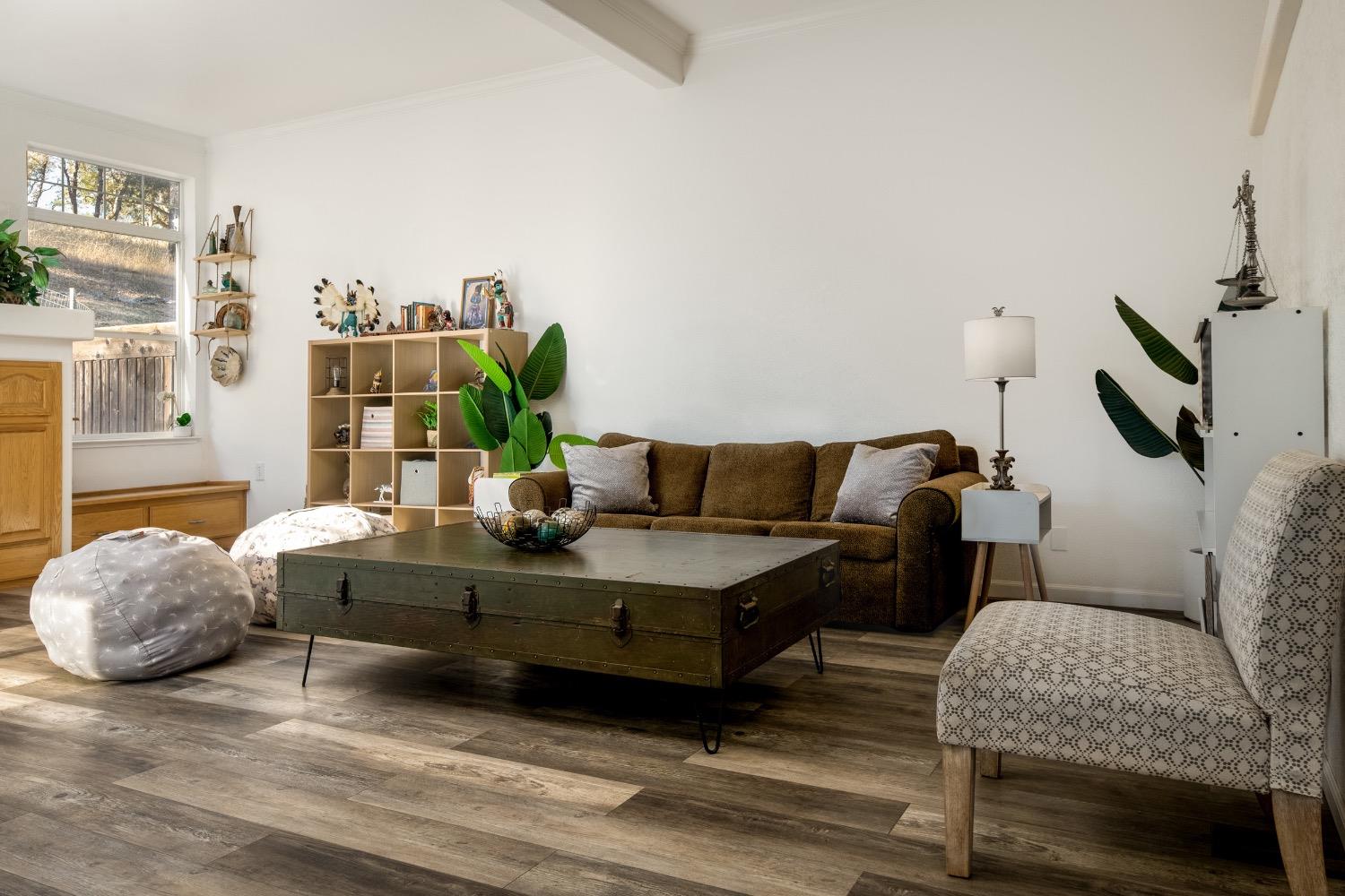 24090 Restive Way Grass Valley, CA 95949 - Photo 14 of 75 a living room with furniture and a potted plant