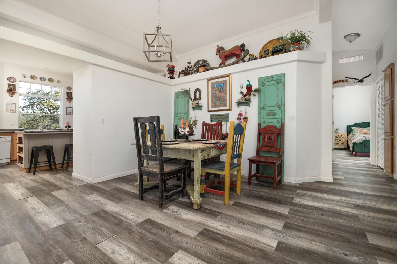 24090 Restive Way Grass Valley, CA 95949 - Photo 16 of 75 a view of a dining room with furniture window and wooden floor