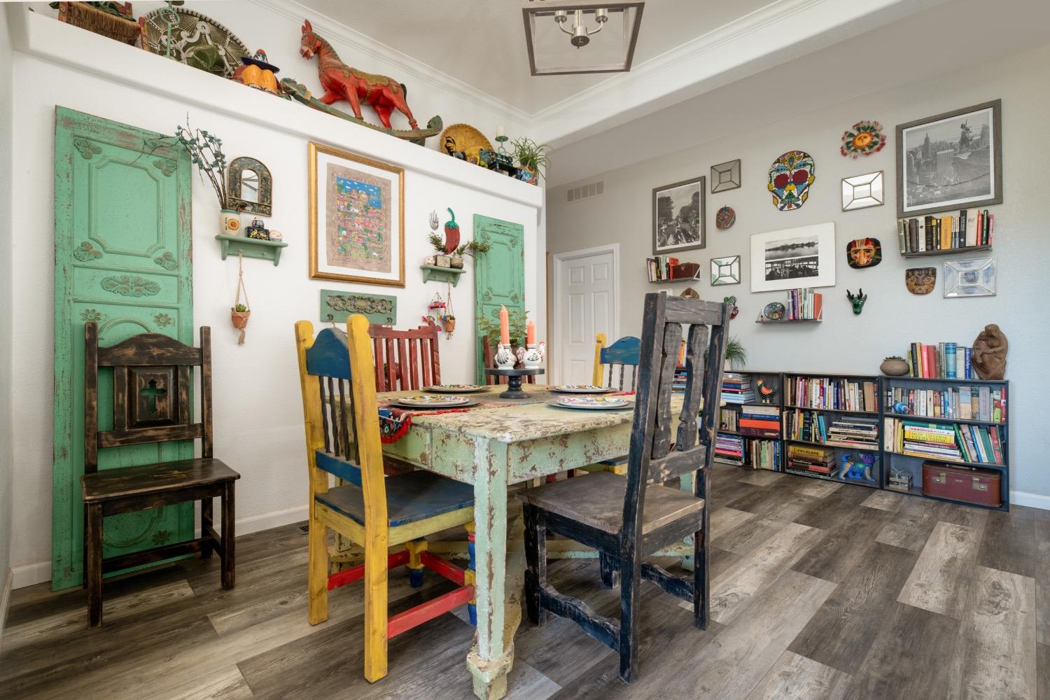24090 Restive Way Grass Valley, CA 95949 - Photo 17 of 75 a view of a dining room with furniture and wooden floor