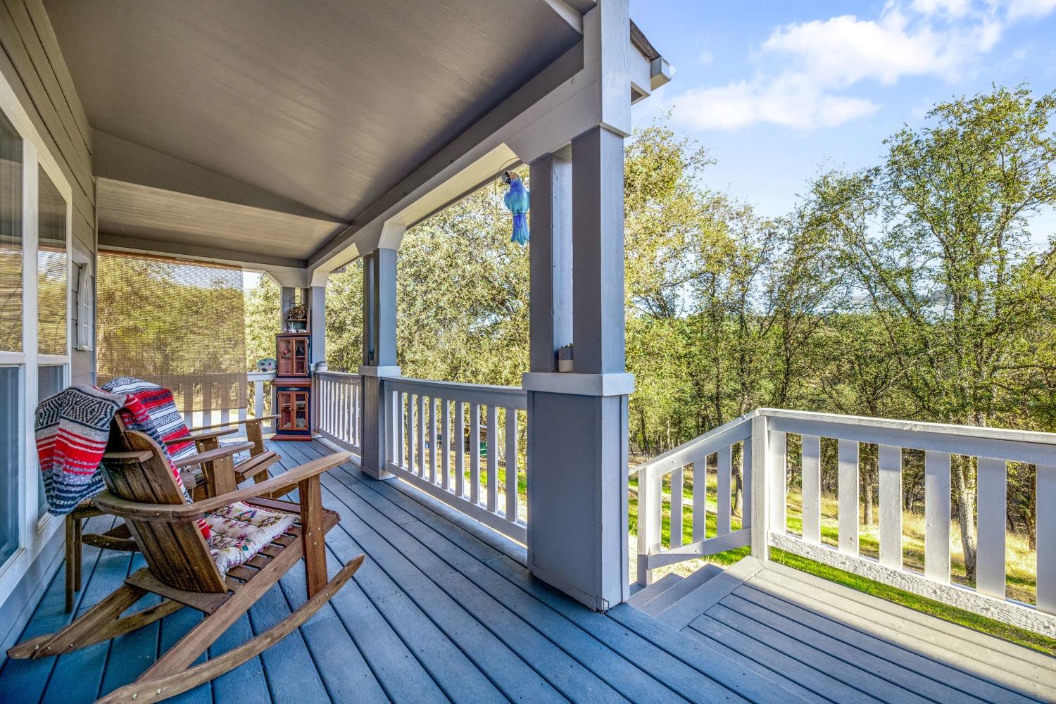 24090 Restive Way Grass Valley, CA 95949 - Photo 4 of 75 a view of a two chairs in the balcony