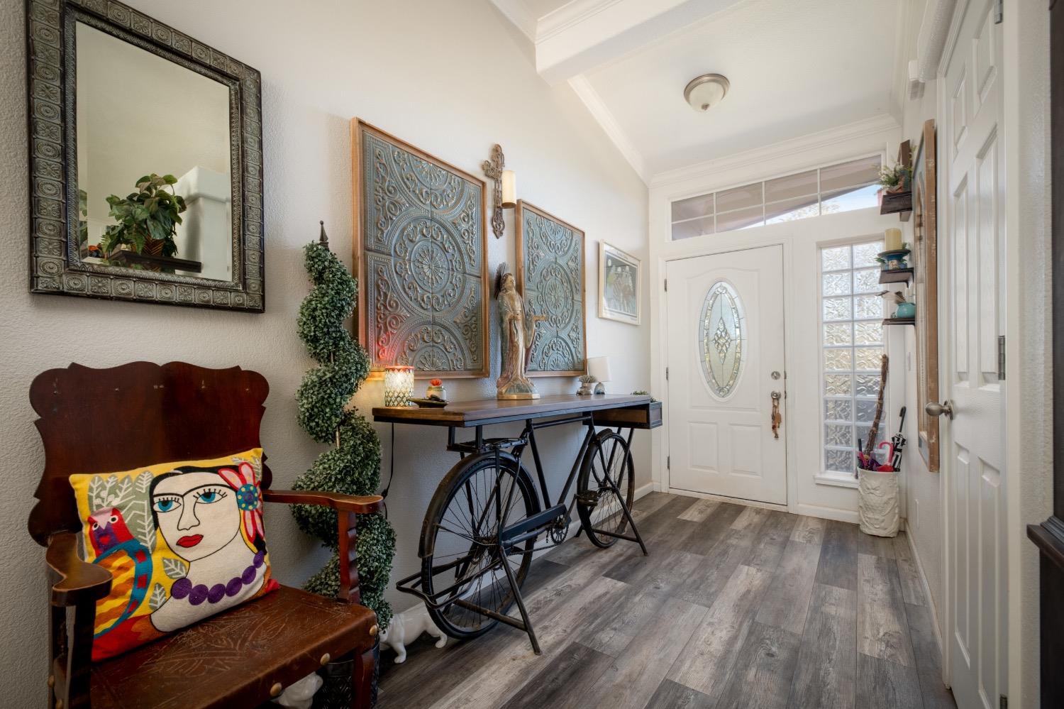 24090 Restive Way Grass Valley, CA 95949 - Photo 43 of 75 a view of a hallway with wooden floor and a potted plant