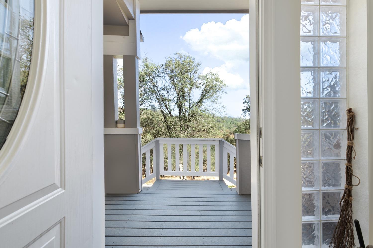 24090 Restive Way Grass Valley, CA 95949 - Photo 44 of 75 a view of a balcony with wooden floor