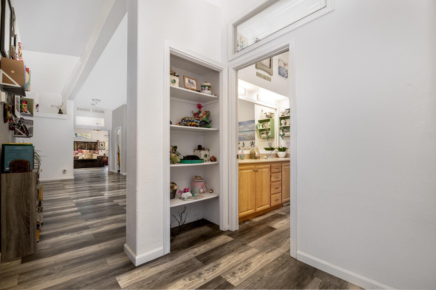 24090 Restive Way Grass Valley, CA 95949 - Photo 51 of 75 a view of hallway with wooden floor and cabinets
