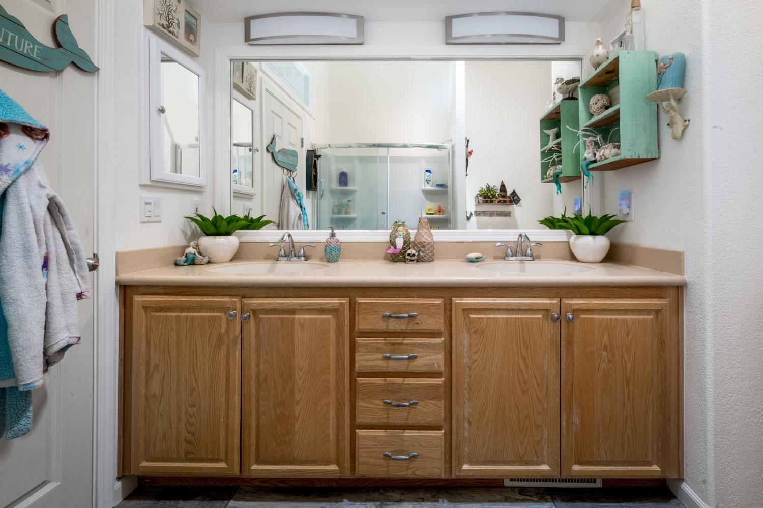 24090 Restive Way Grass Valley, CA 95949 - Photo 53 of 75 a bathroom with a sink vanity granite and a mirror