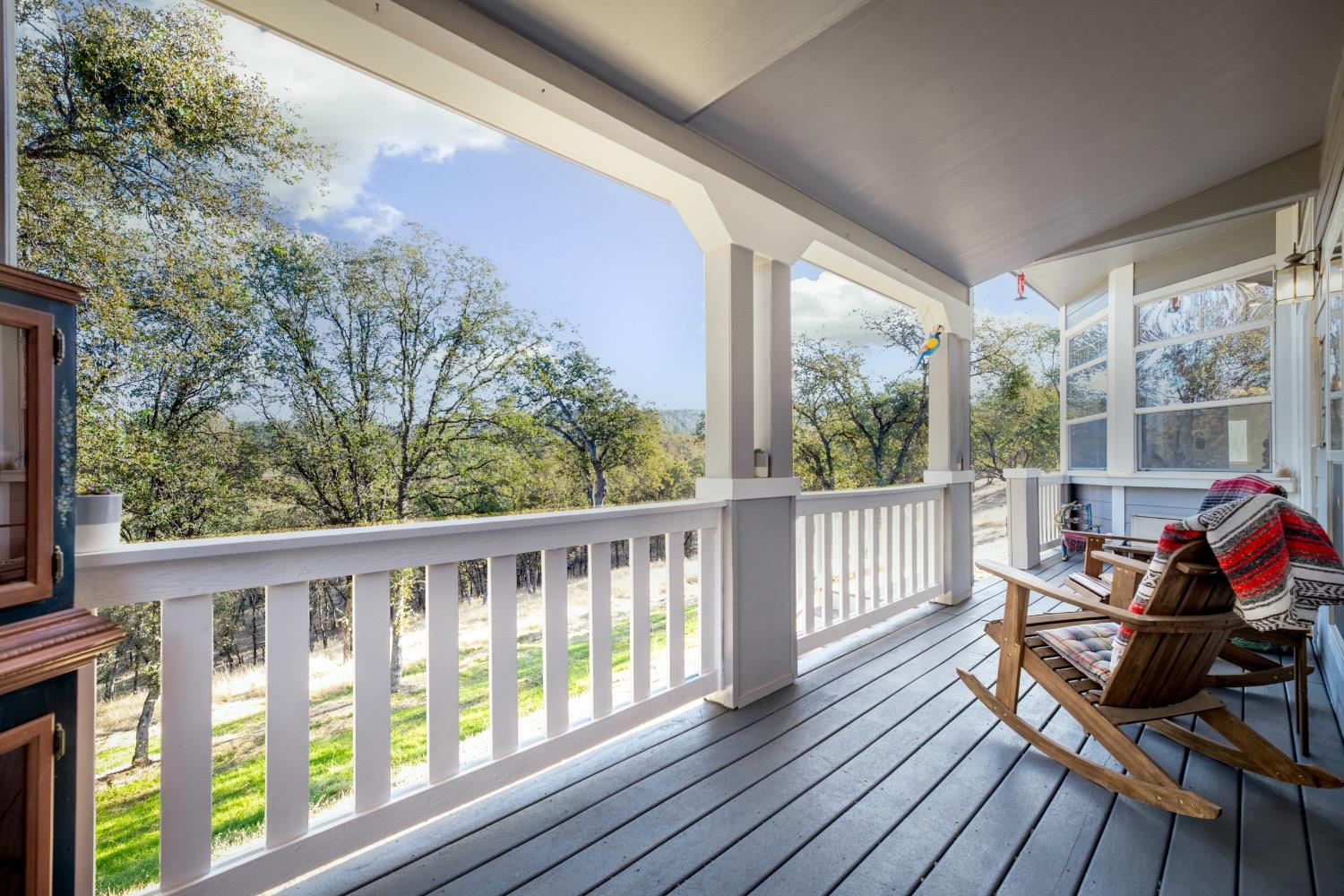 24090 Restive Way Grass Valley, CA 95949 - Photo 7 of 75 a view of a two chairs in the balcony